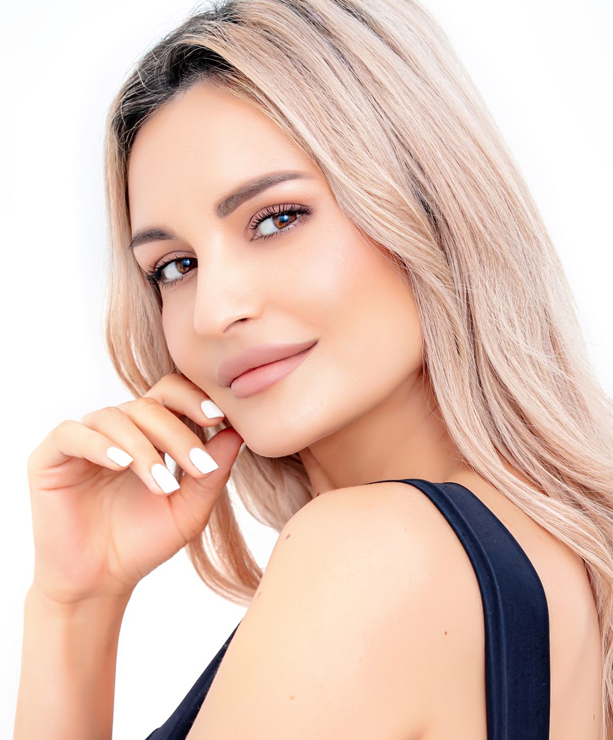 Portrait of a woman with blonde hair smiling.